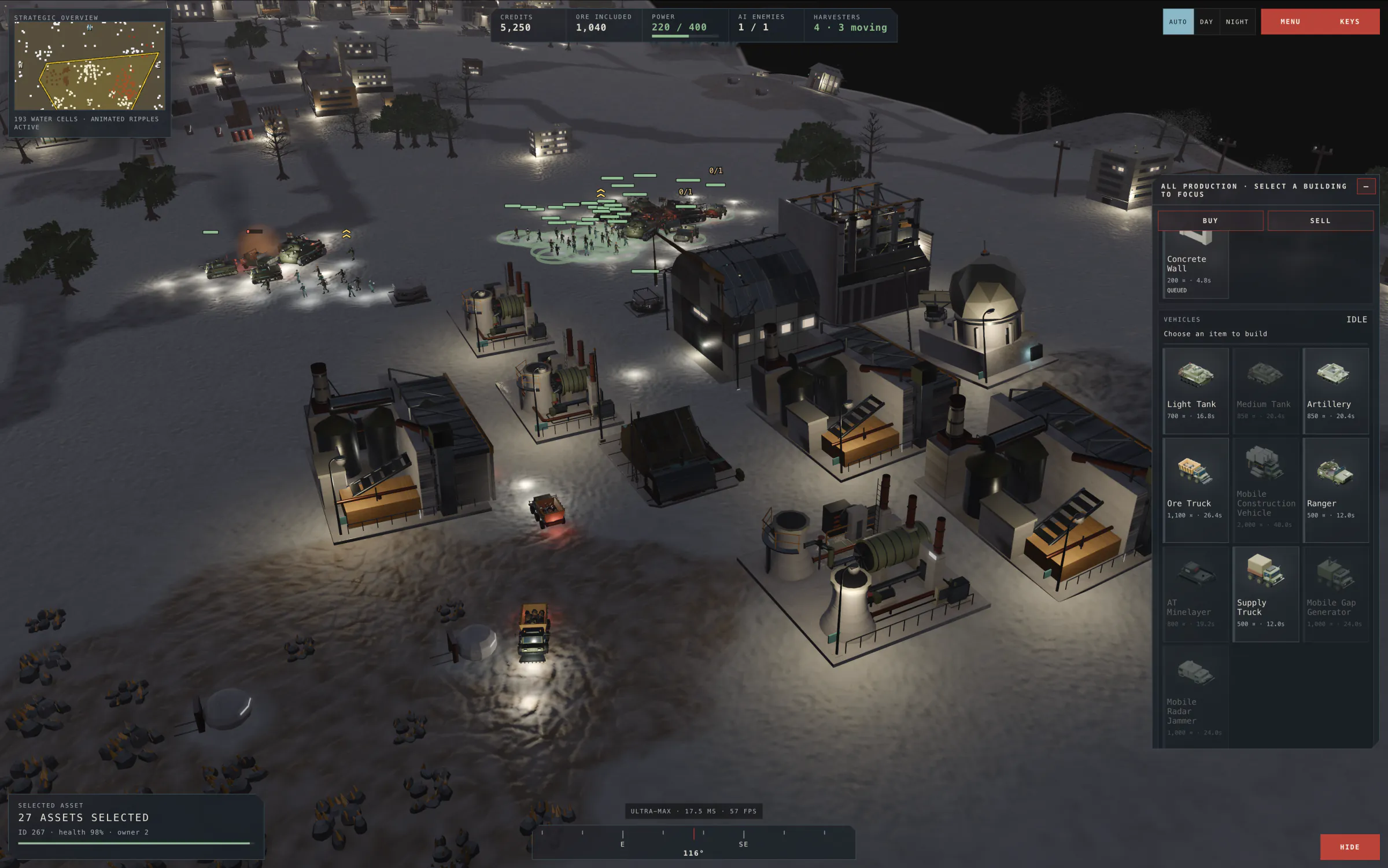 The same base at night, lit by vehicle headlights, street lamps and lit windows.